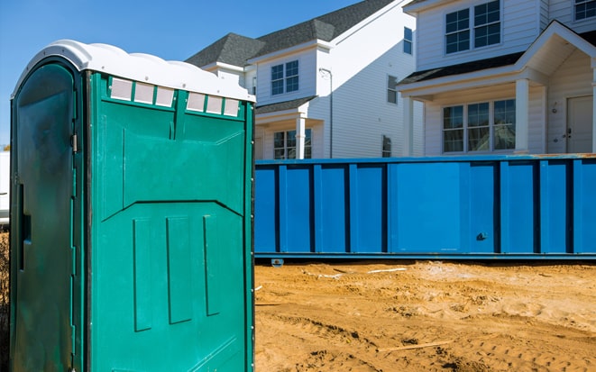 dumpster and portable toilet at a construction site in Evansville IN